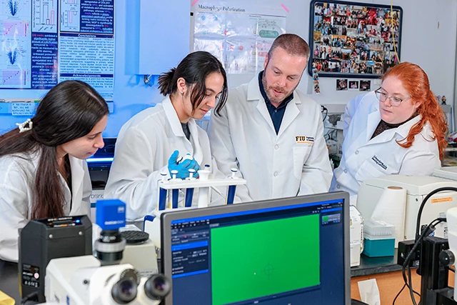 Joshua Hutcheson and students in his lab